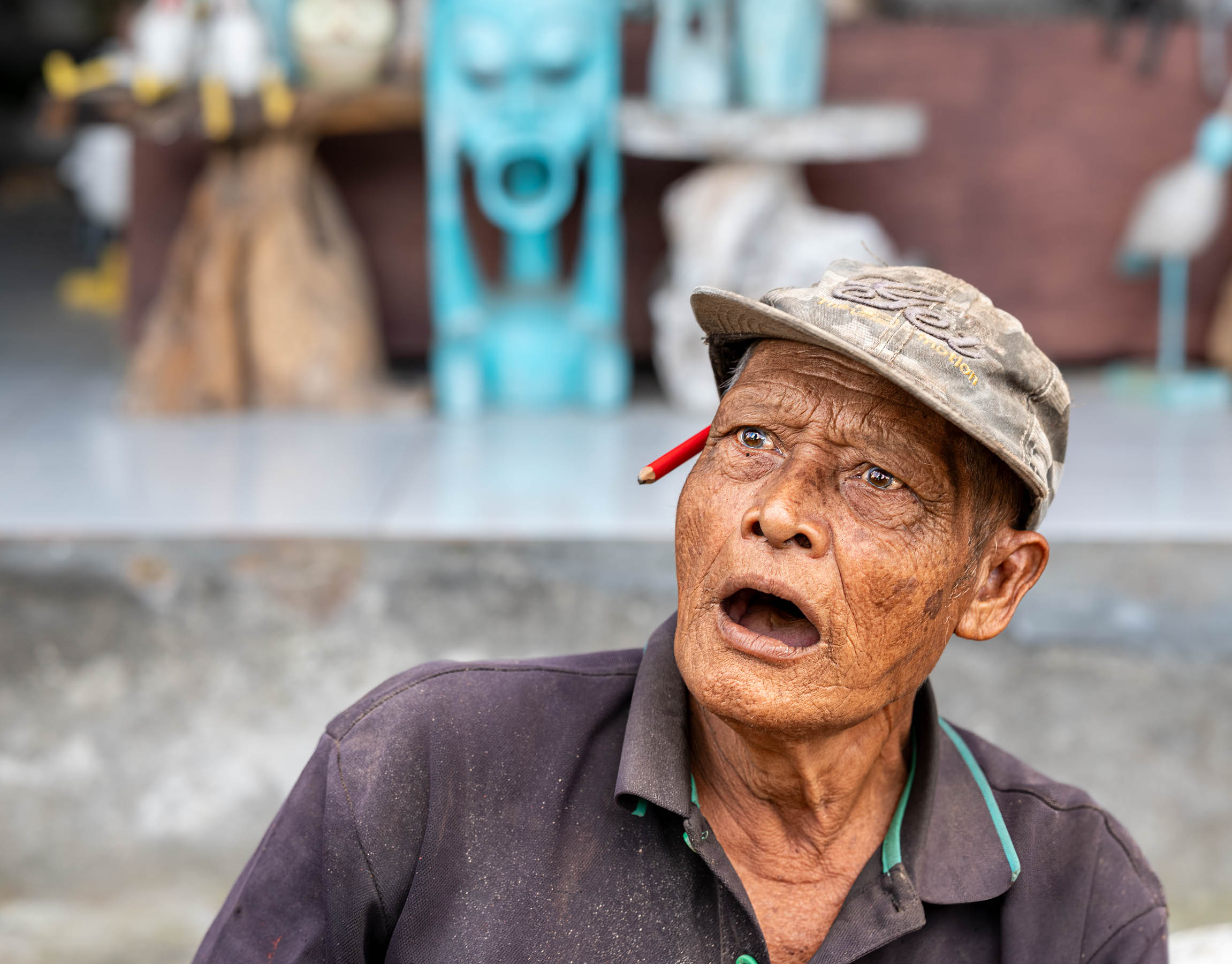 Man in a cap looking upward, Indonesia