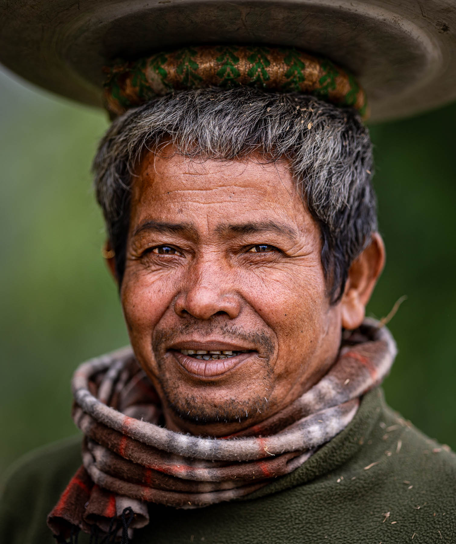 Man carrying a basket on his head, Nepal