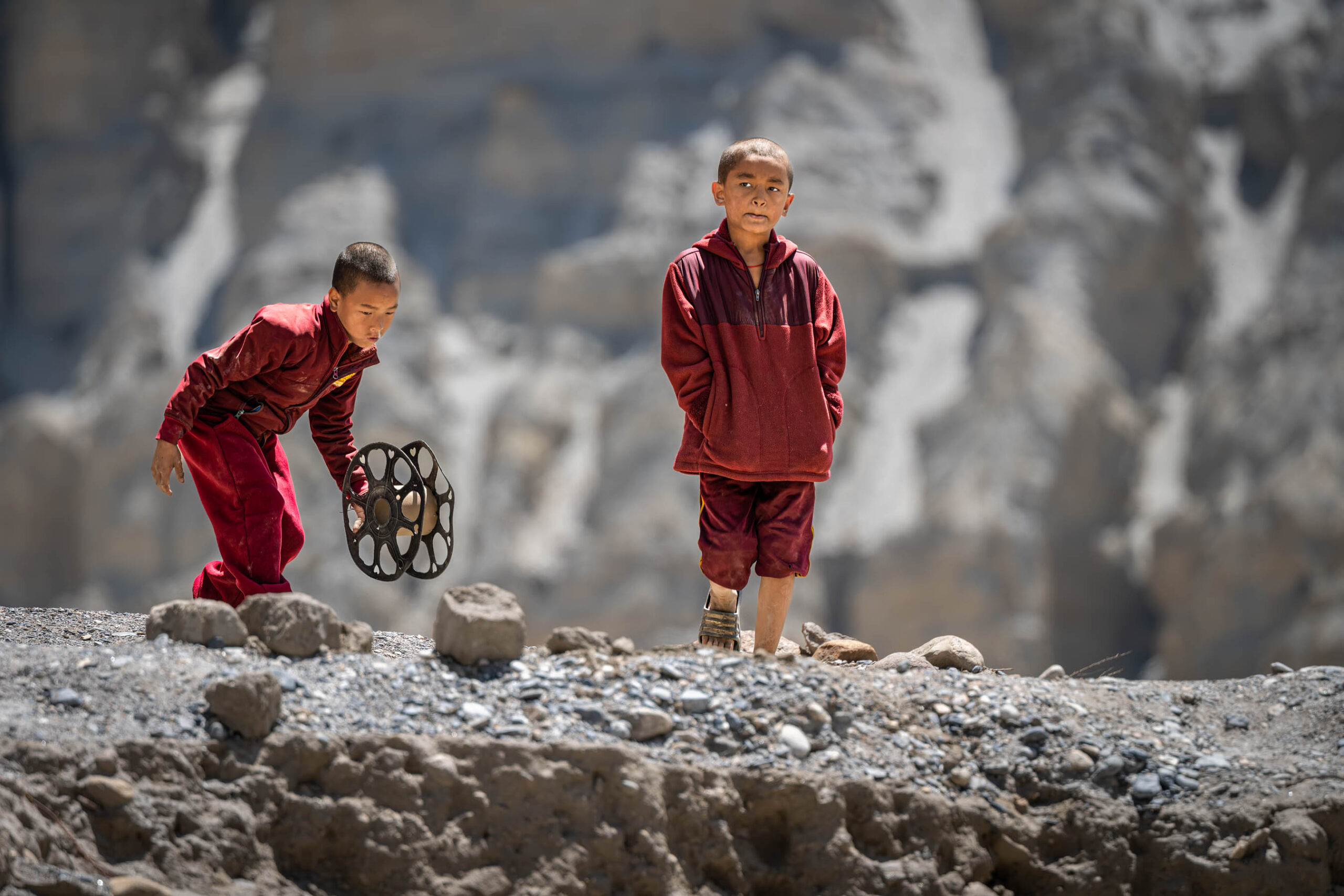 Two young monks playing outdoors, Mustang, Nepal