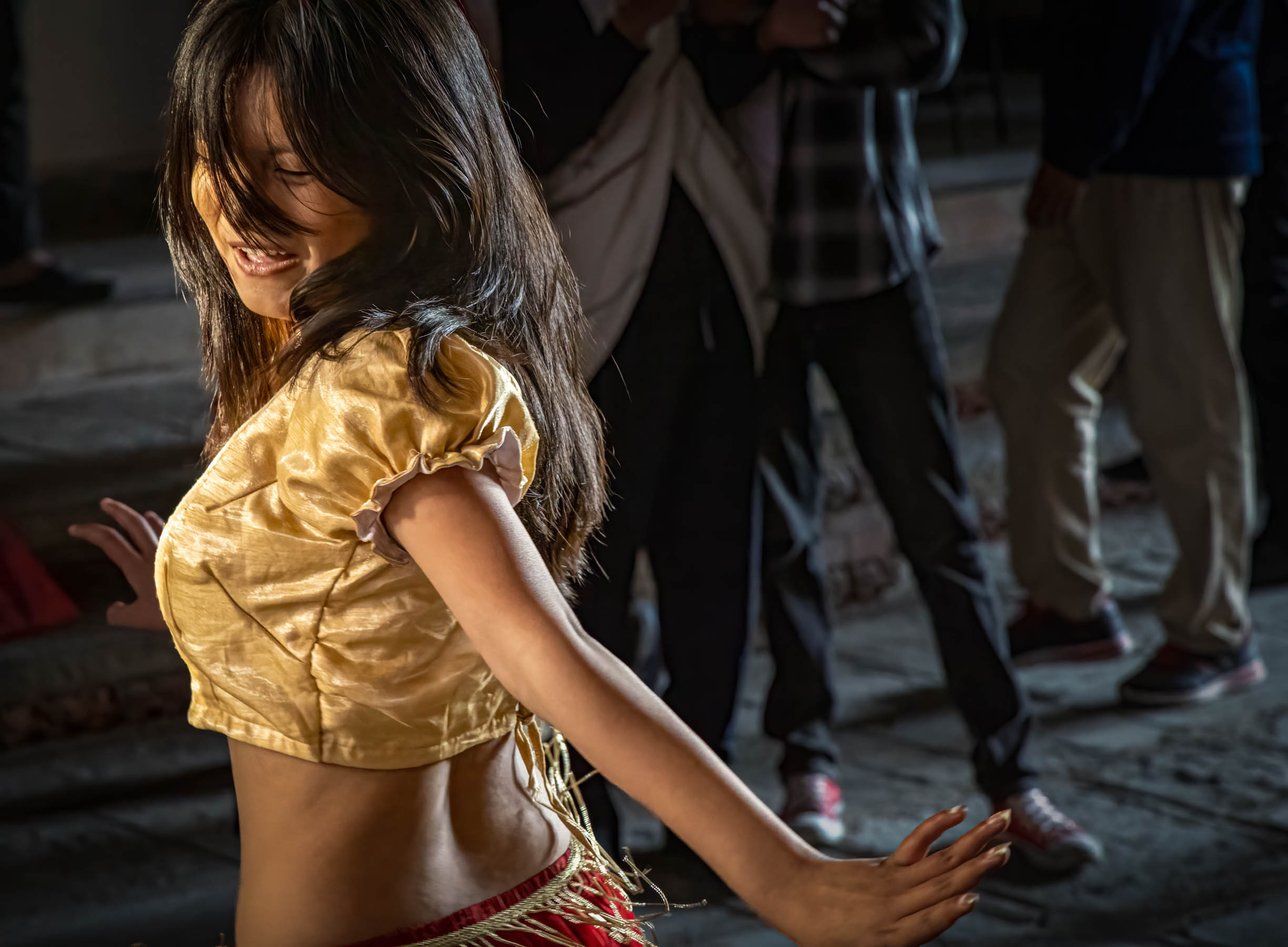Girl dancing in a doorway, Nepal