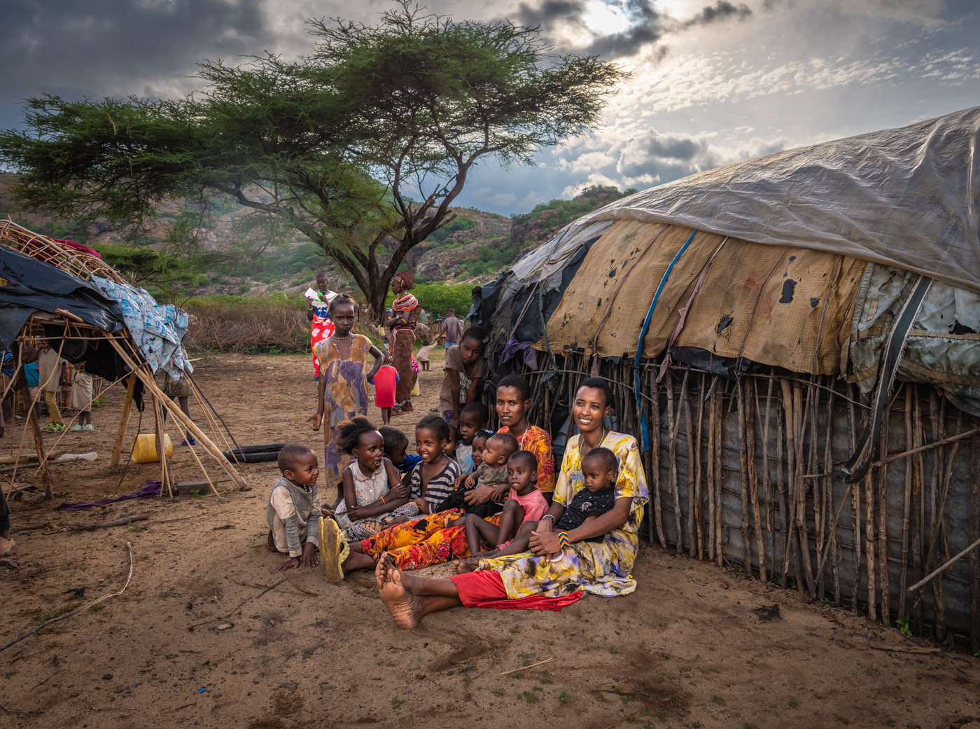 Women and children outside their homes, northern Kenya