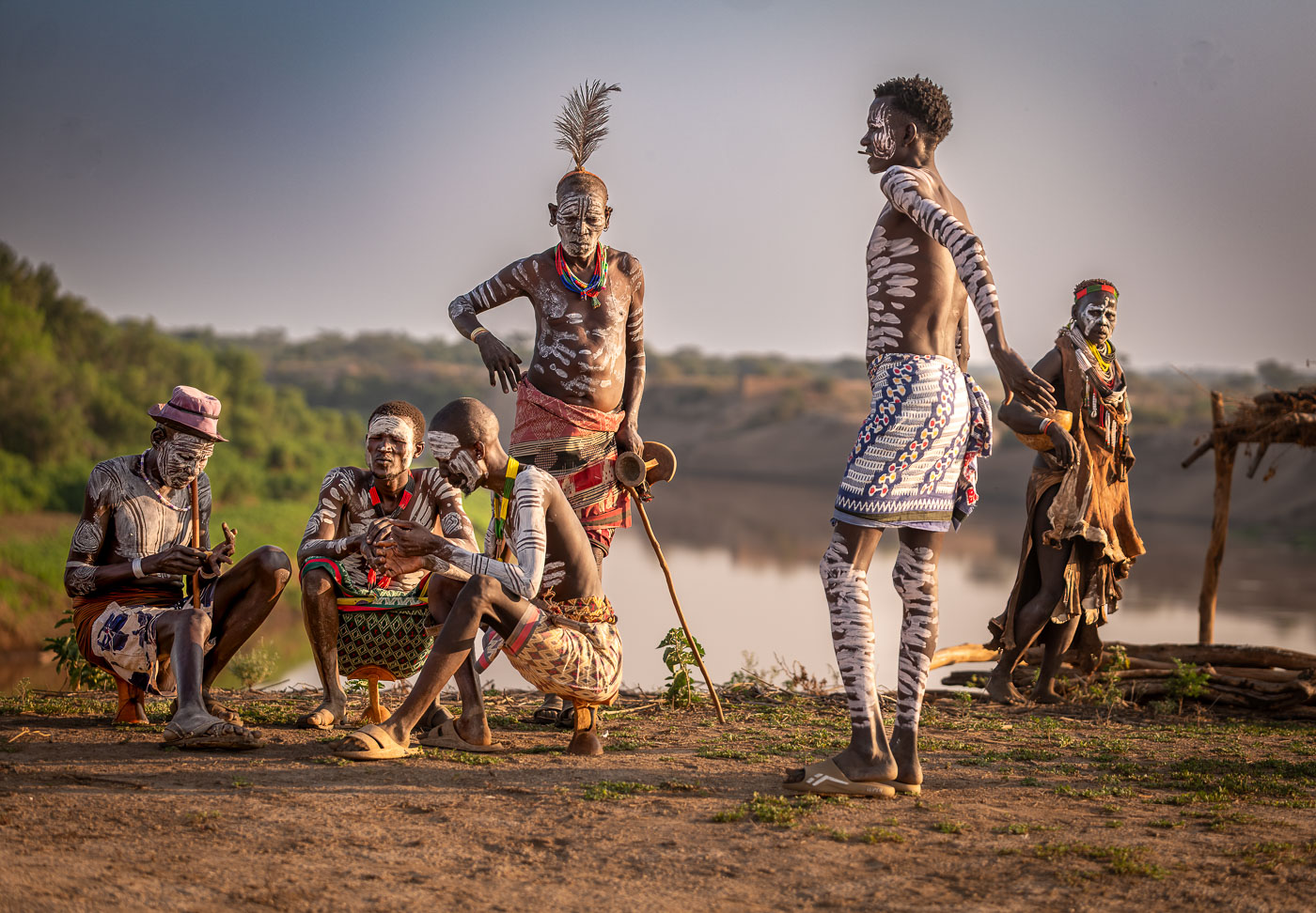Kara men by the Omo River at dawn, Ethiopia